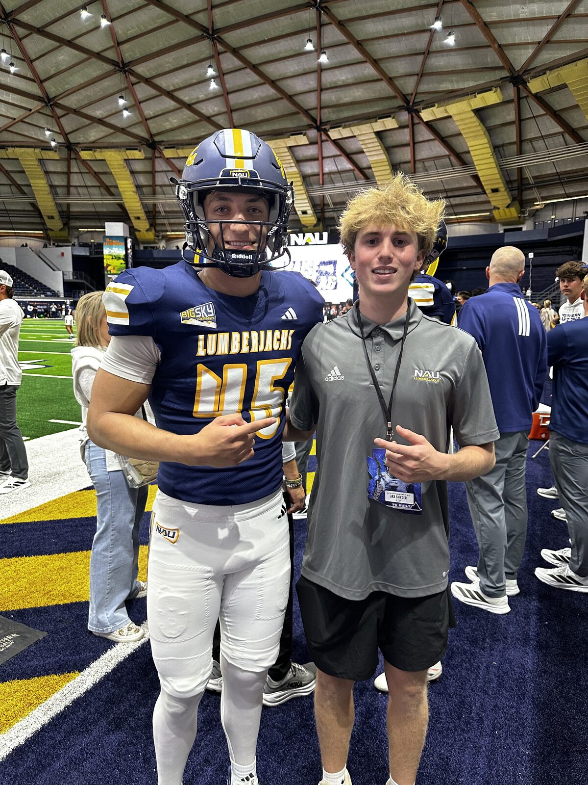 Jax Snyder and a Northern Arizona Lumberjacks player pointing at each other on the field inside the Walkup Skydome